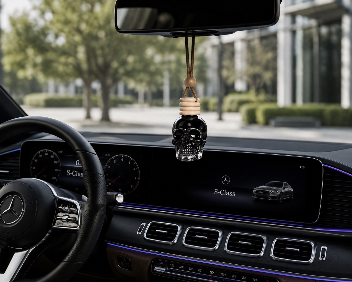 LUX DRIVE skull car diffuser hanging inside a luxury car